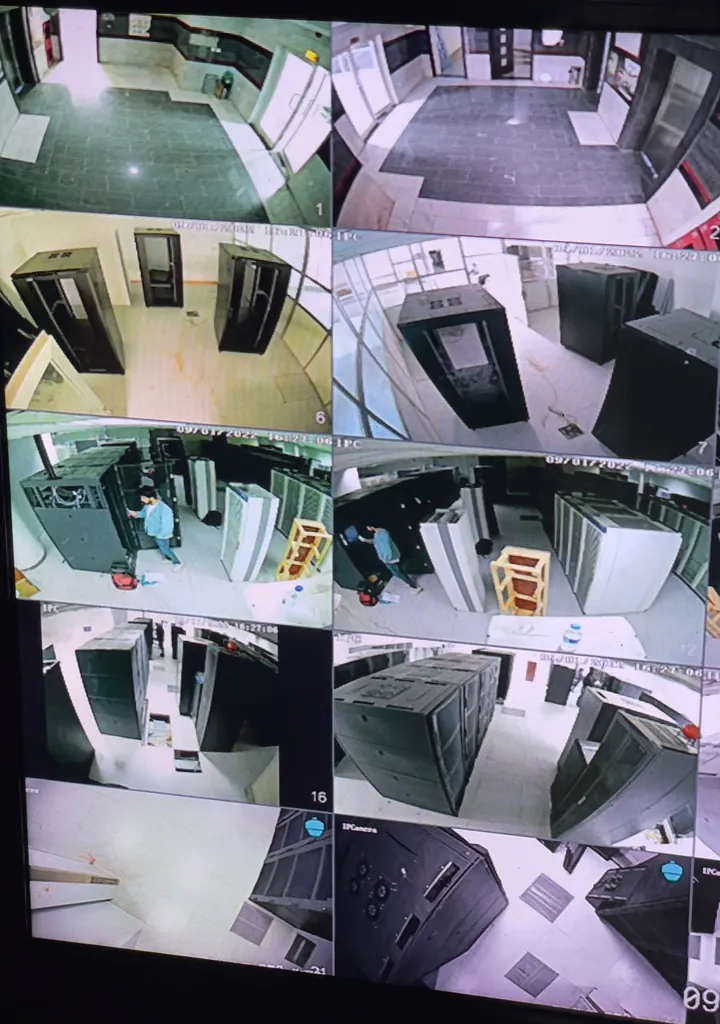 A CCTV monitor showing a data centre under construction